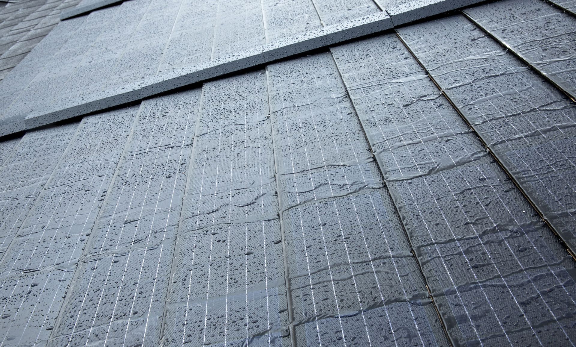 A close up of a roof with a lot of tiles on it.