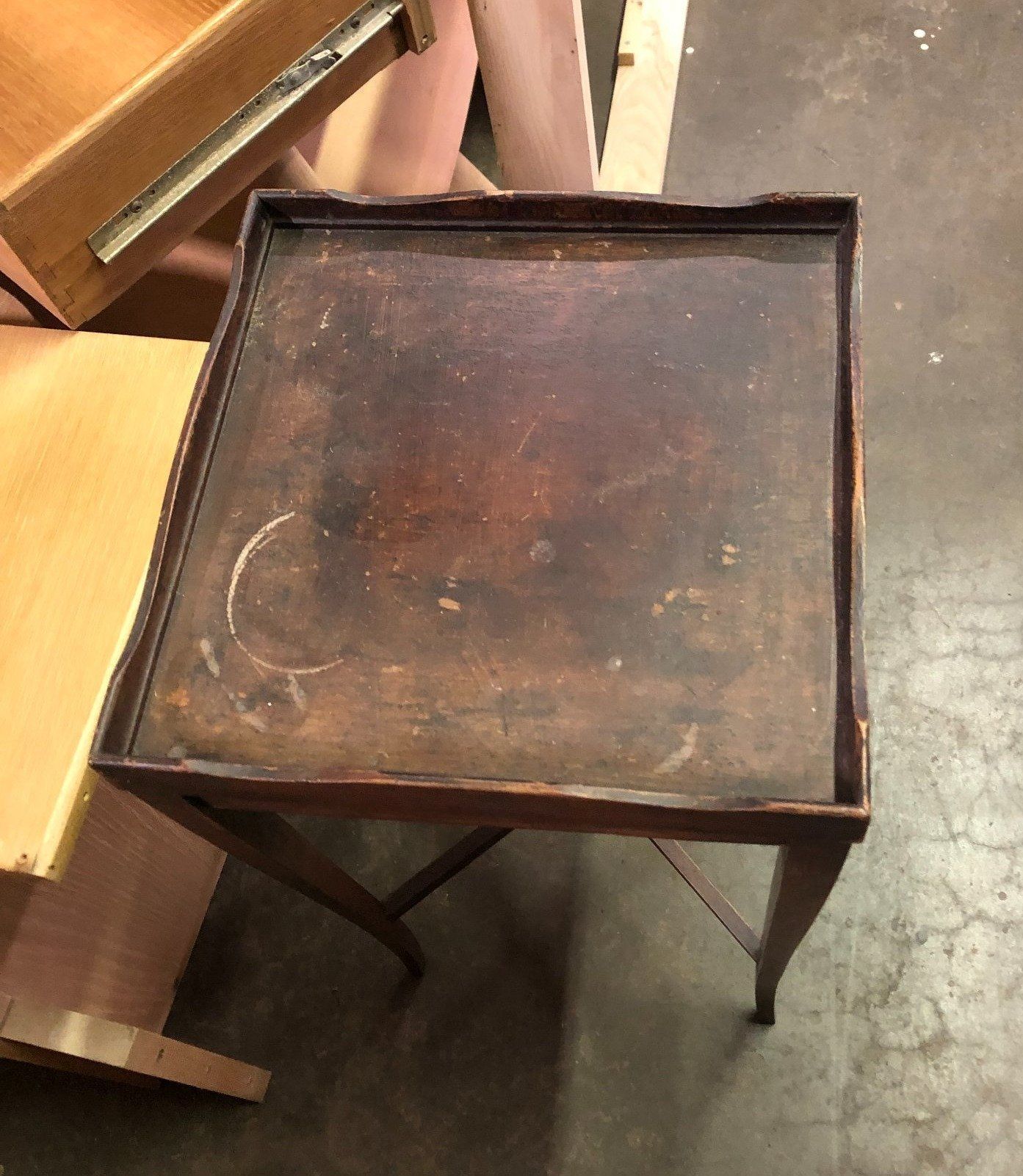 a small table with a tray on top of it