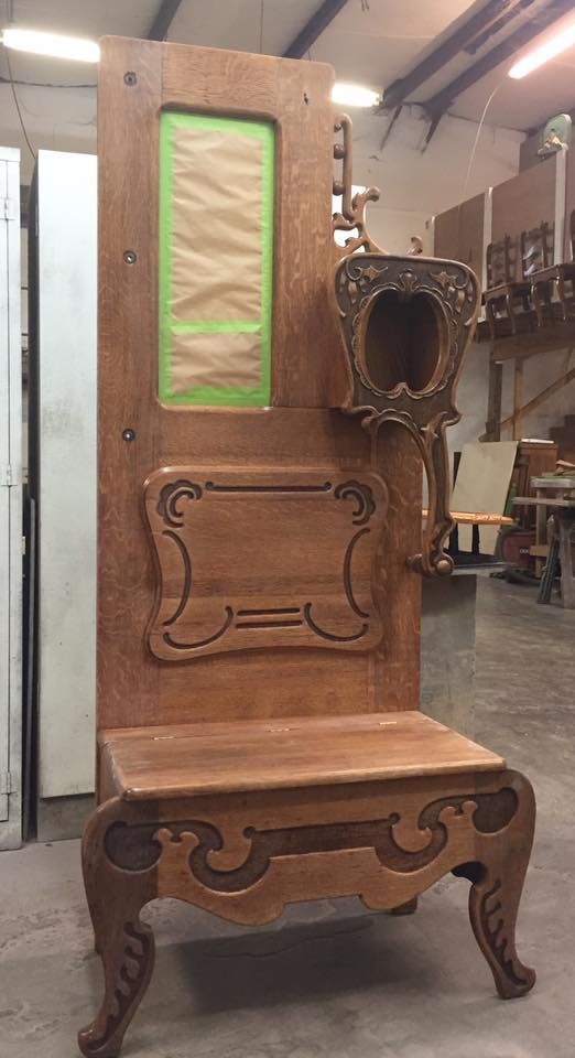 a wooden chair made out of a door in a room