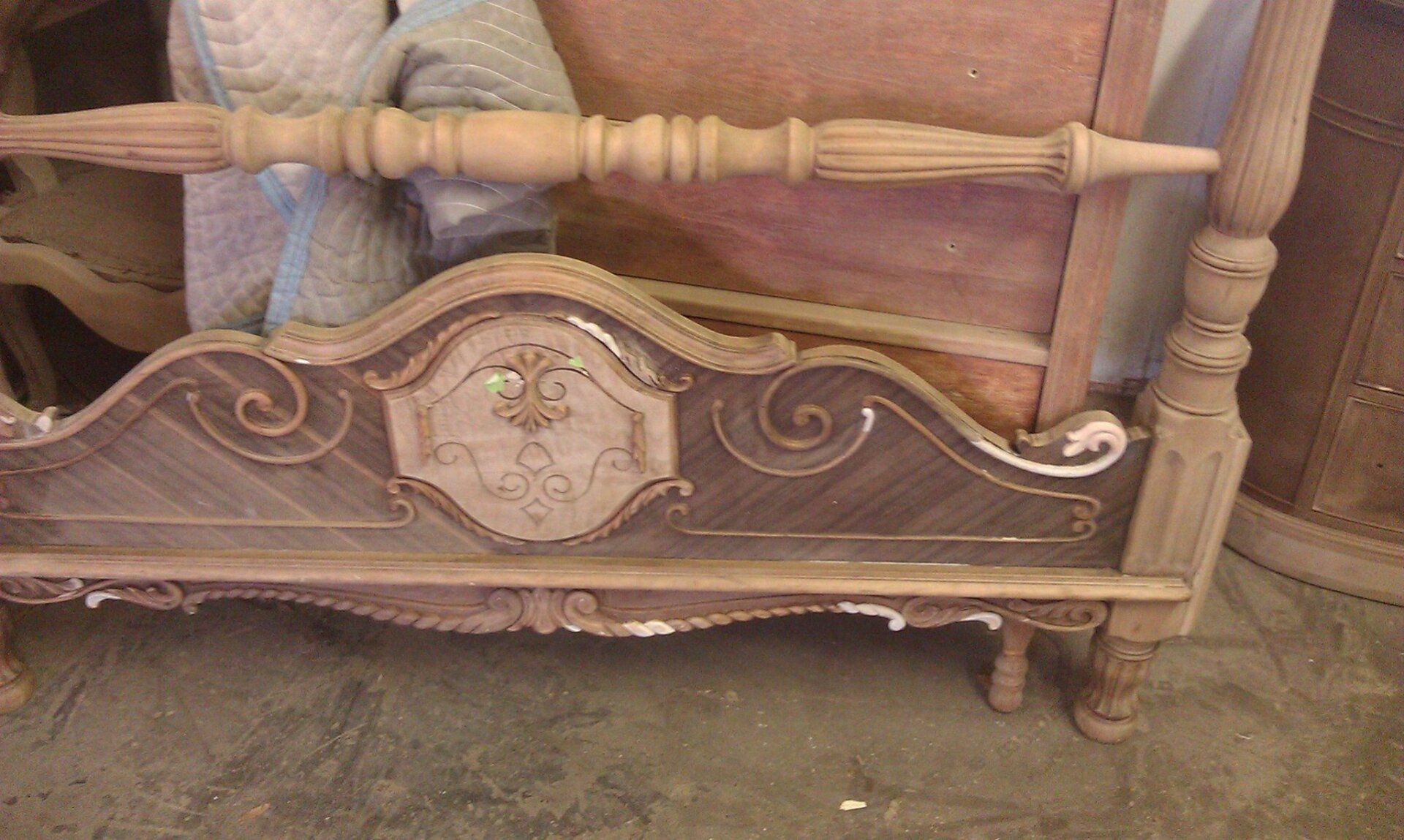 a wooden bench with a floral design on it is sitting on the floor