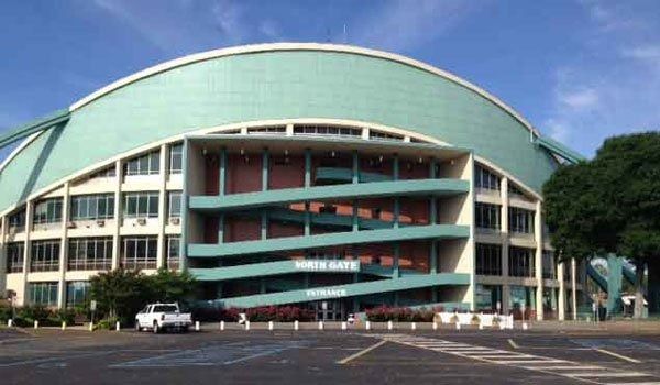 Exterior of the North Gate entrance of the Honolulu Civic Auditorium, a large teal and white domed building.