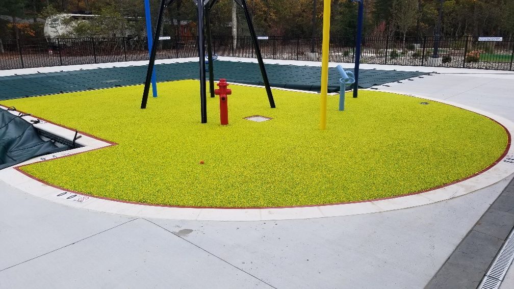 A playground with a fire hydrant in the middle of it.