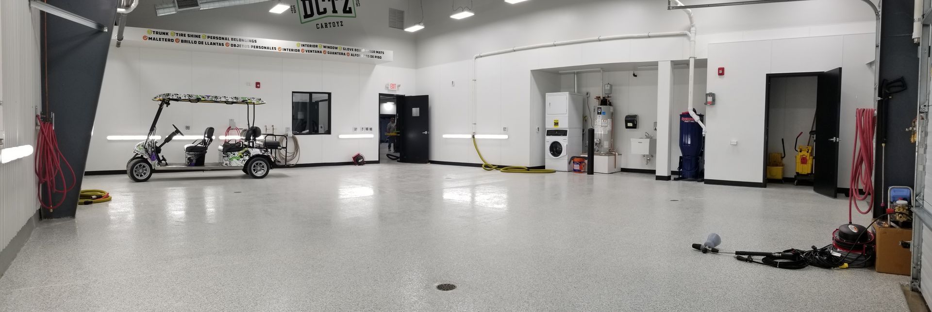 There is a golf cart in the middle of the room.