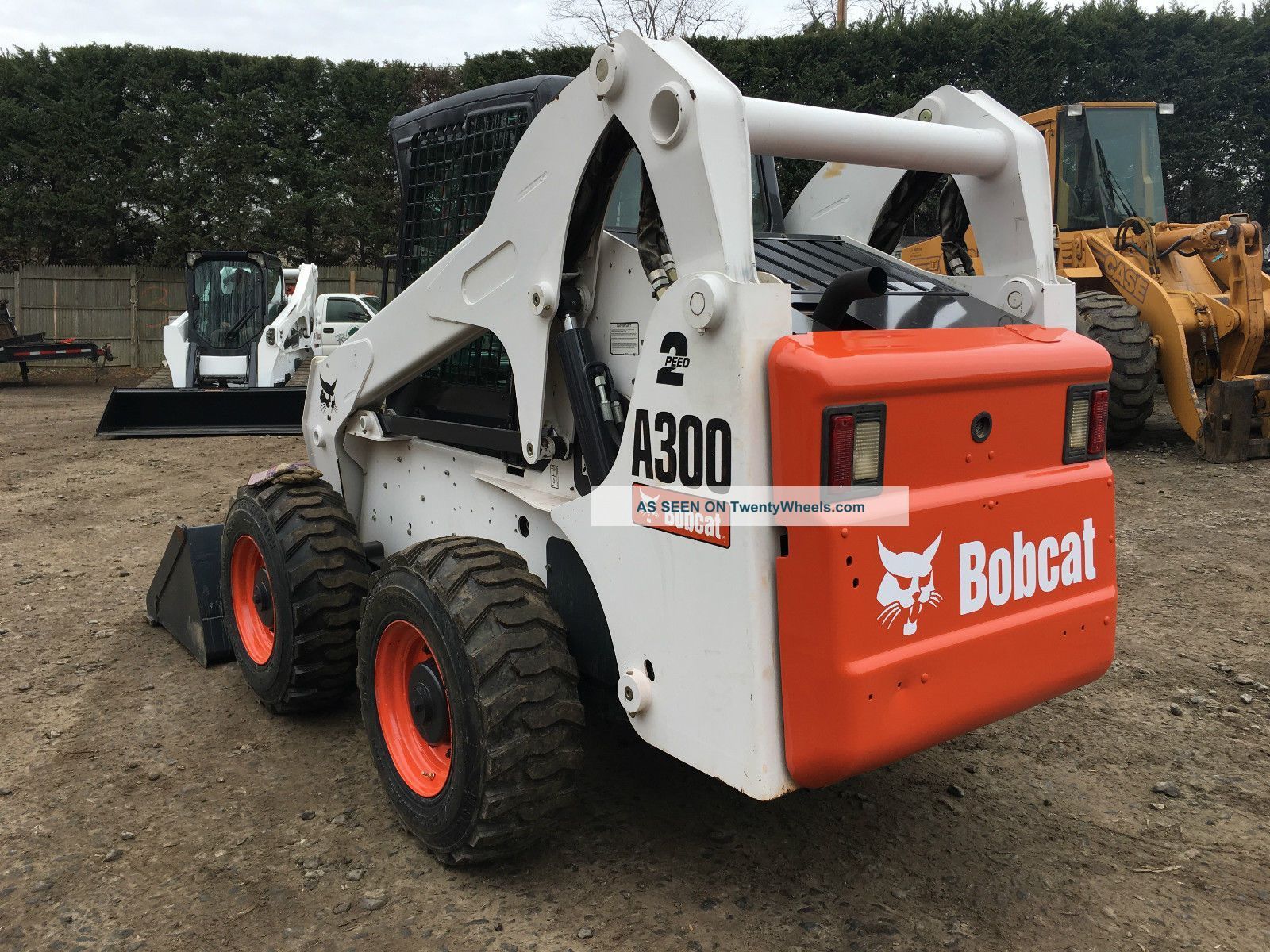 A bobcat 8300 skid steer is parked in a dirt lot.