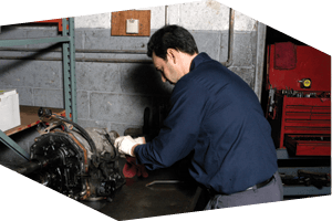 Auto technician repairing auto transmission