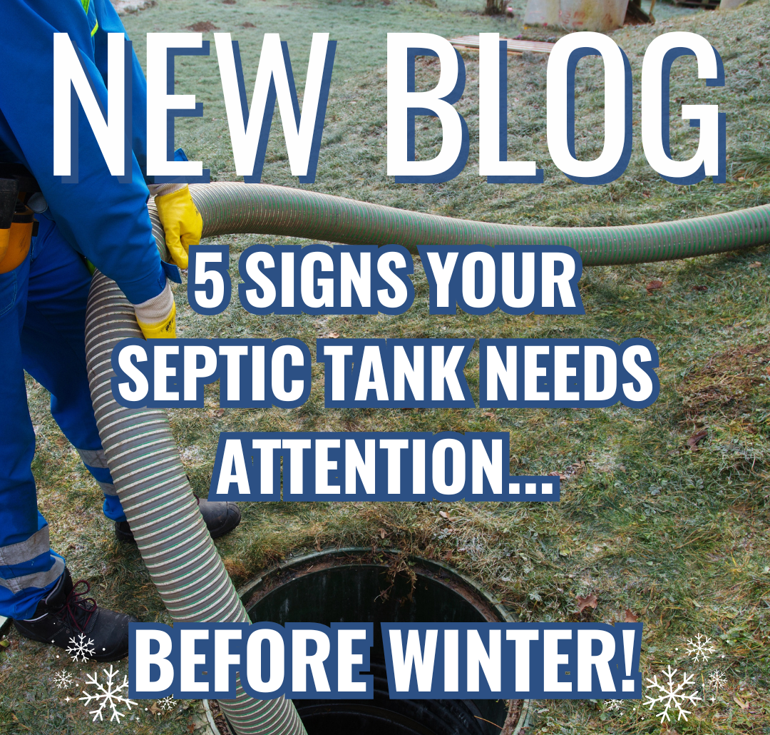 A worker dressed in PPE, pumping out a septic tank on a frosted lawn.