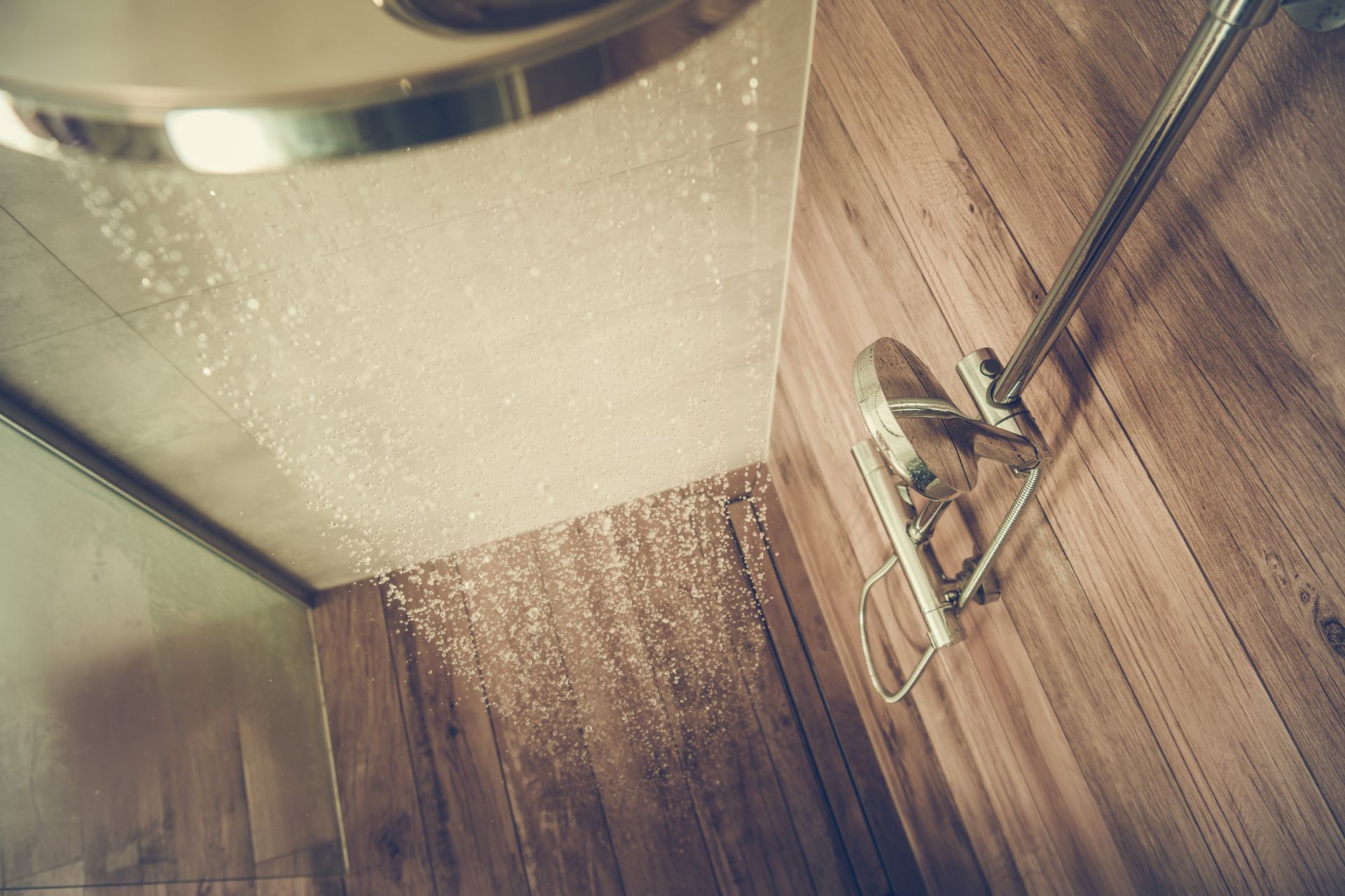 Water pours from a showerhead and into a Vermont septic system.