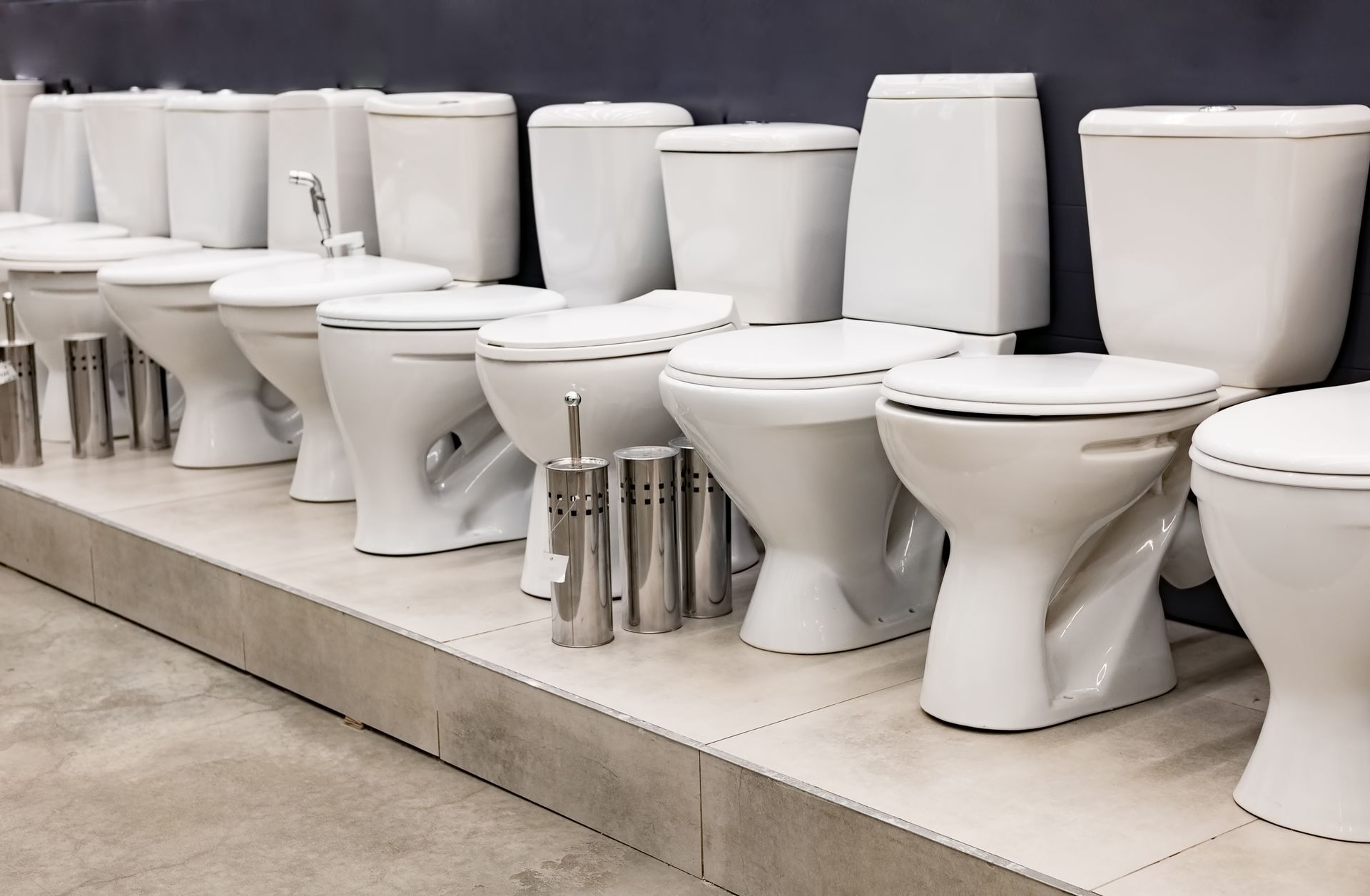 Toilets lined up in a show room