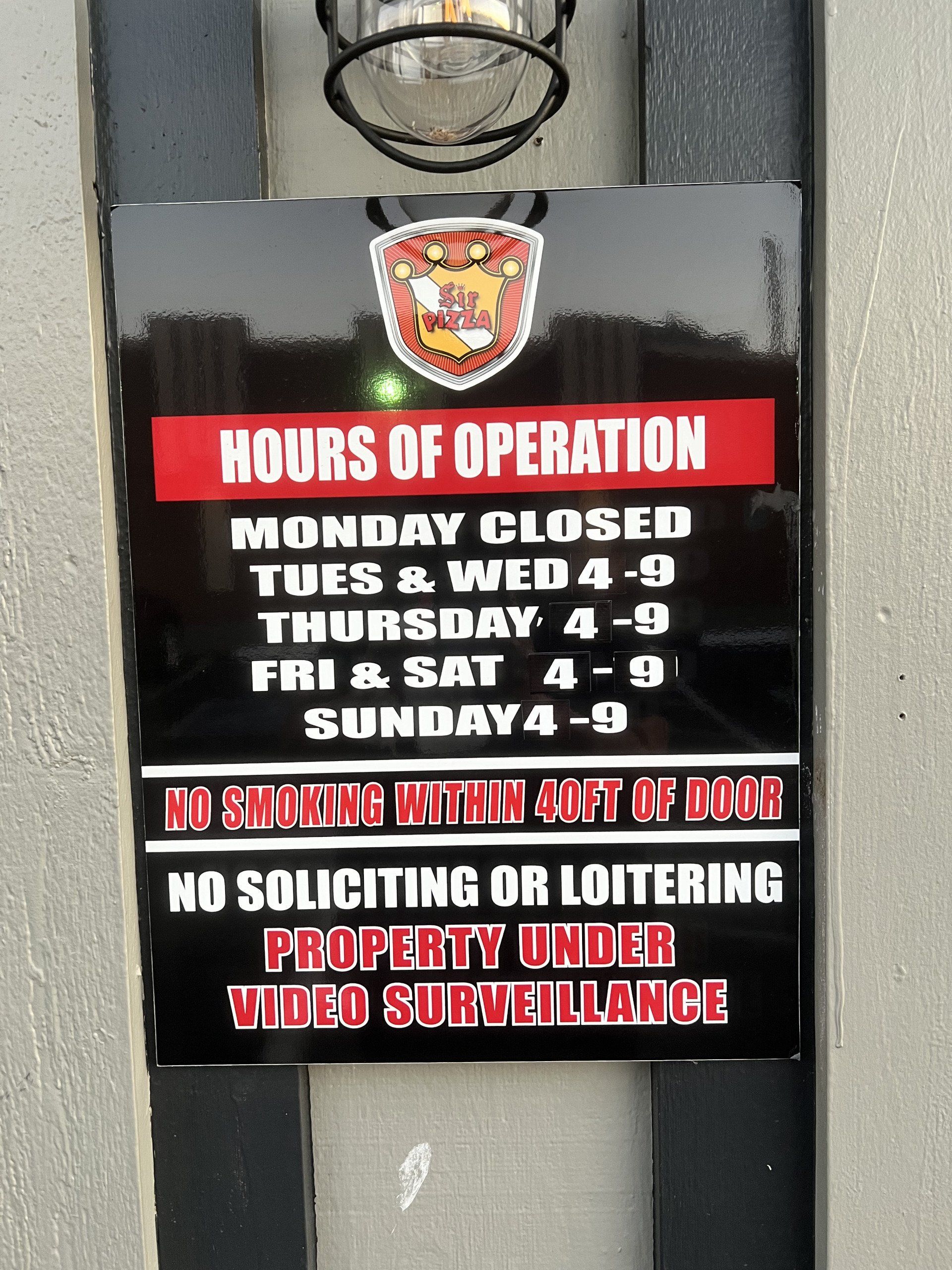 Hours of operation sign