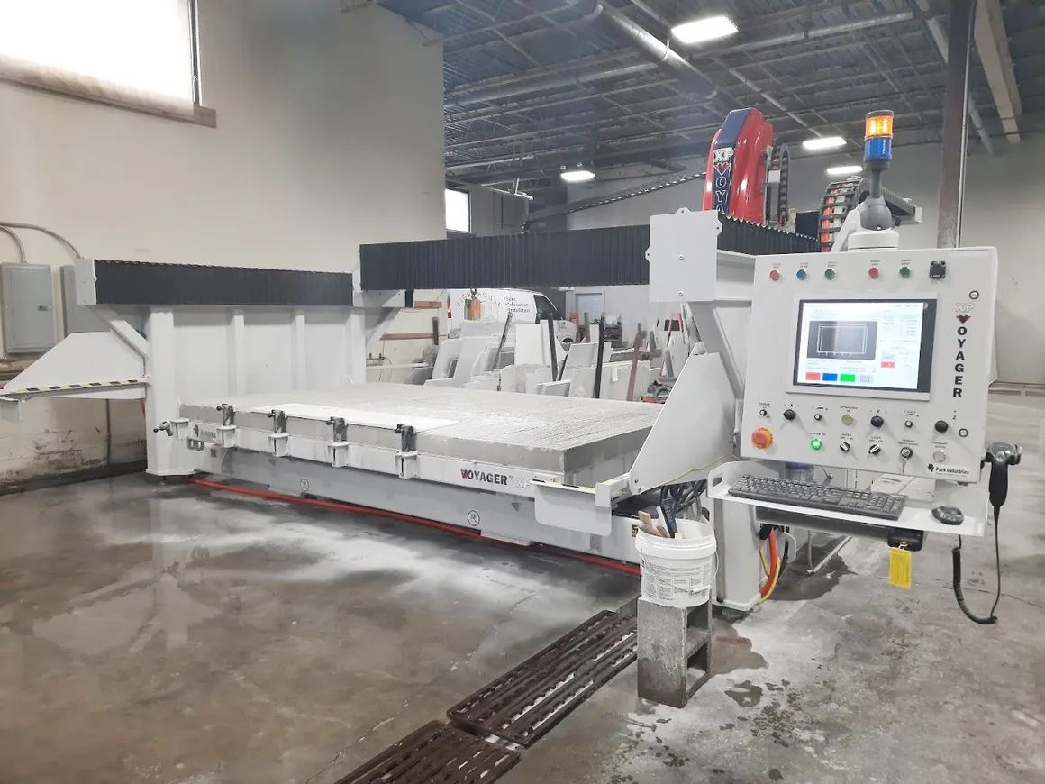 a large machine is sitting in a warehouse next to a window