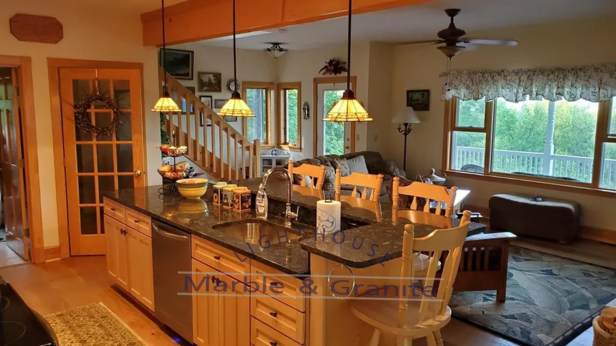 a kitchen with granite counter tops and wooden cabinets