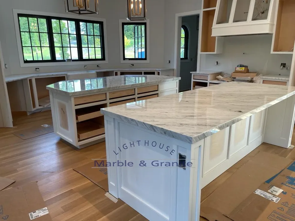a kitchen with a large island in the middle of it