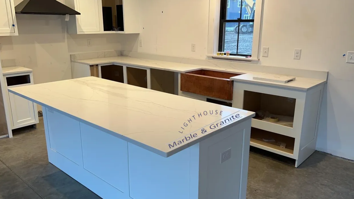 a kitchen with a large island and a sink