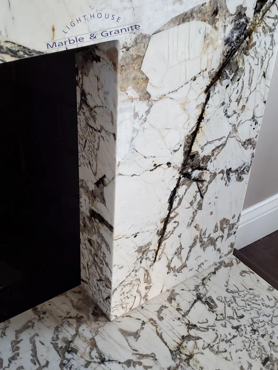 a white marble fireplace