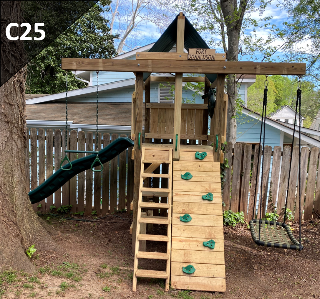 A wooden playground set with a slide and stairs in a backyard.