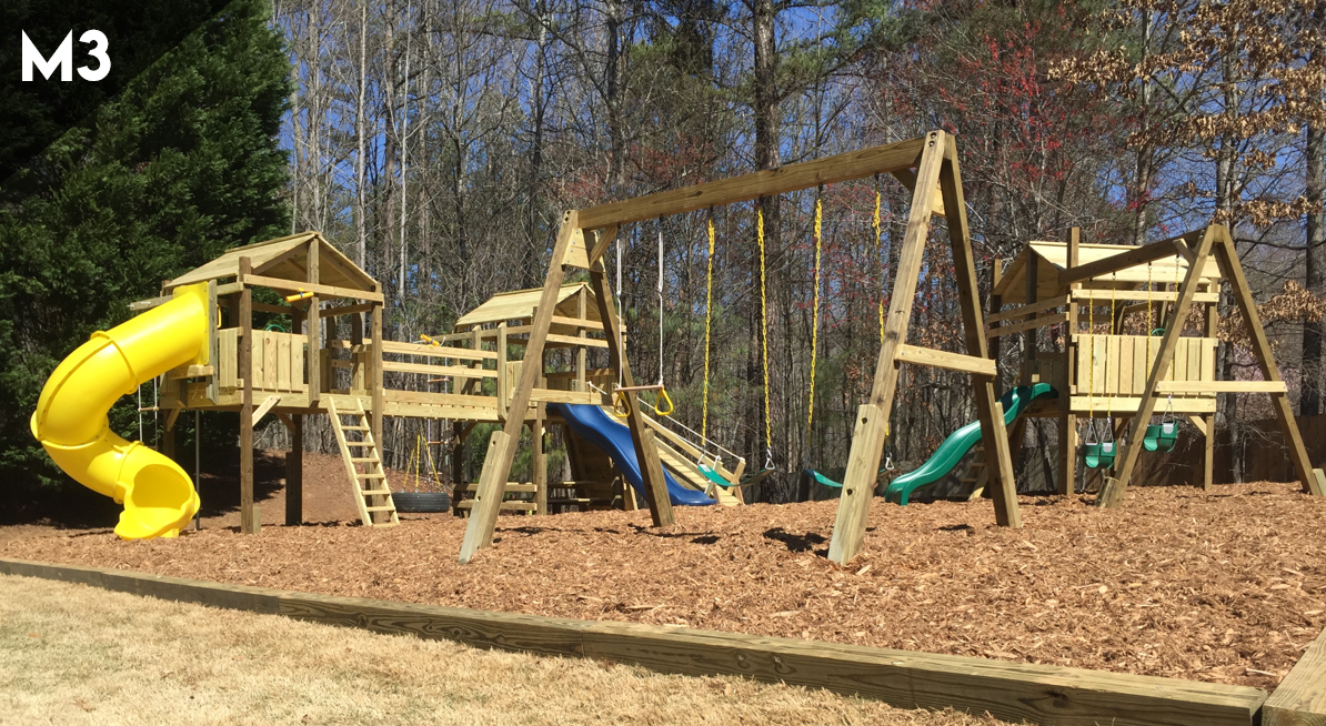 A wooden playground with a yellow slide and swings.