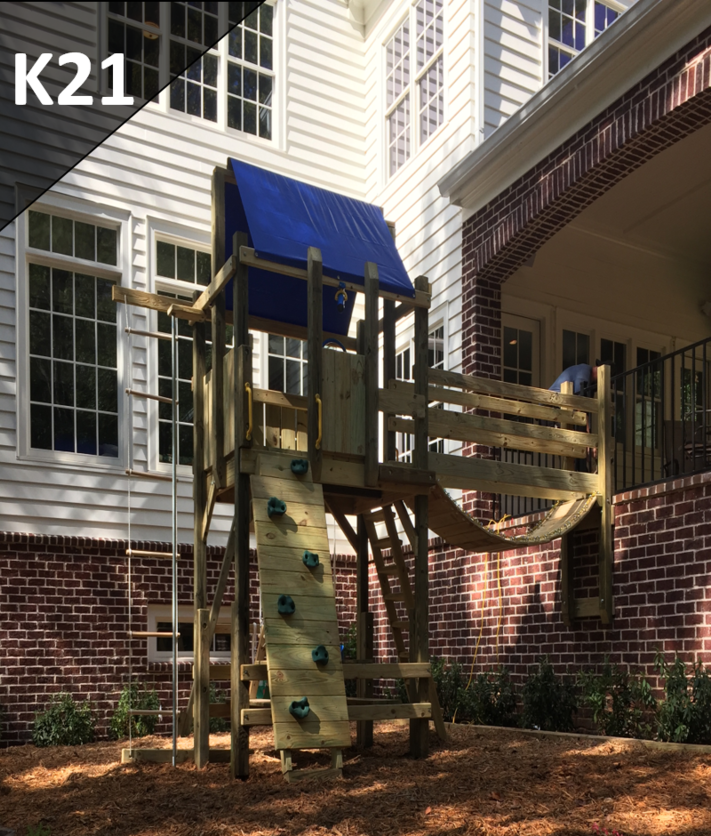 A brick house with a wooden playground in front of it