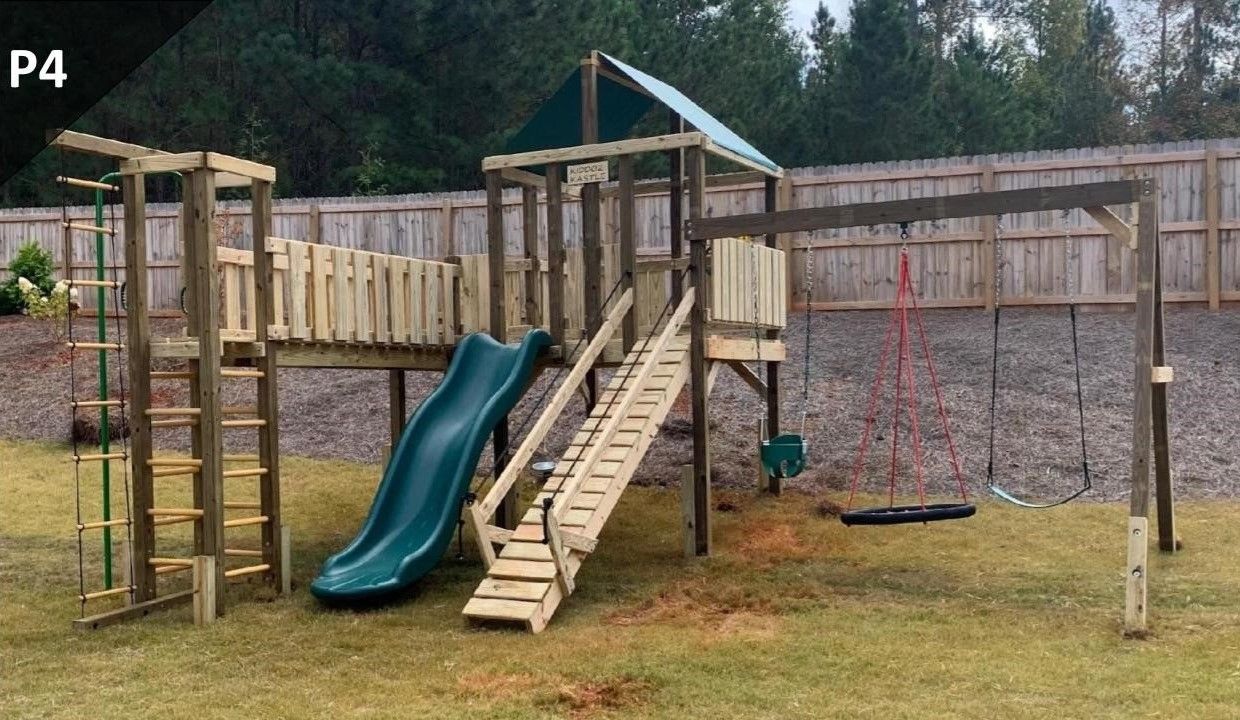 A wooden playground set with a slide and swings