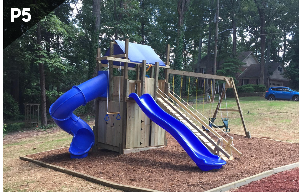 A wooden playground with a blue slide and swings