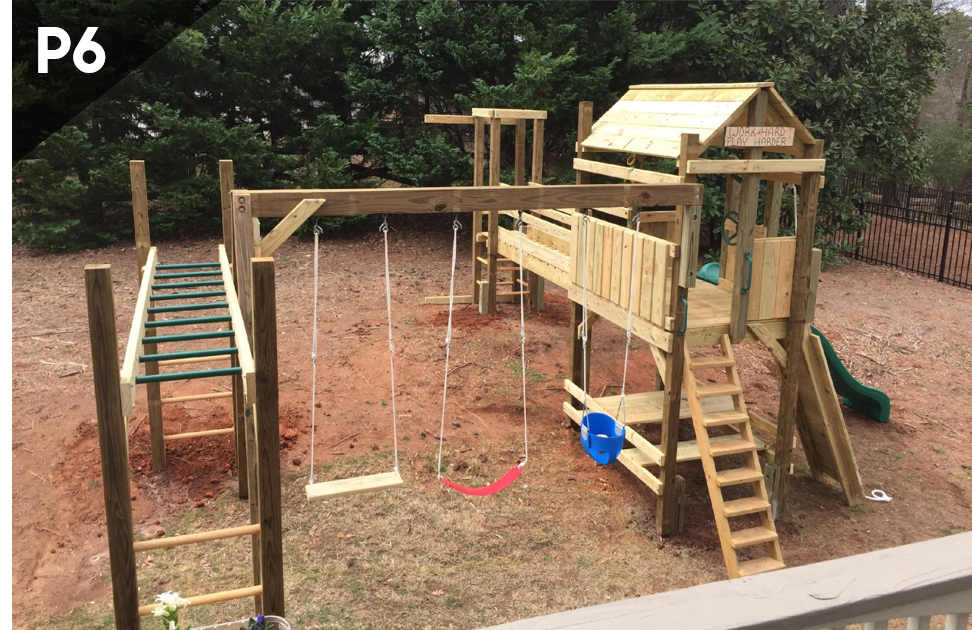 A wooden playground is being built in a backyard.