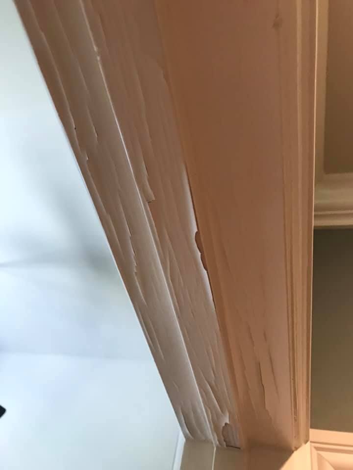 A close up of a door with a hole in it.