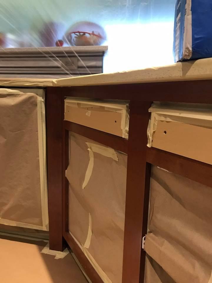 A corner of a room with a box on top of it