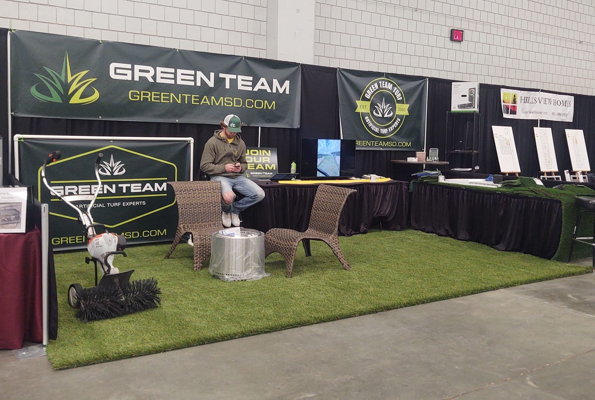 Green Team booth at trade show, showcasing artificial turf