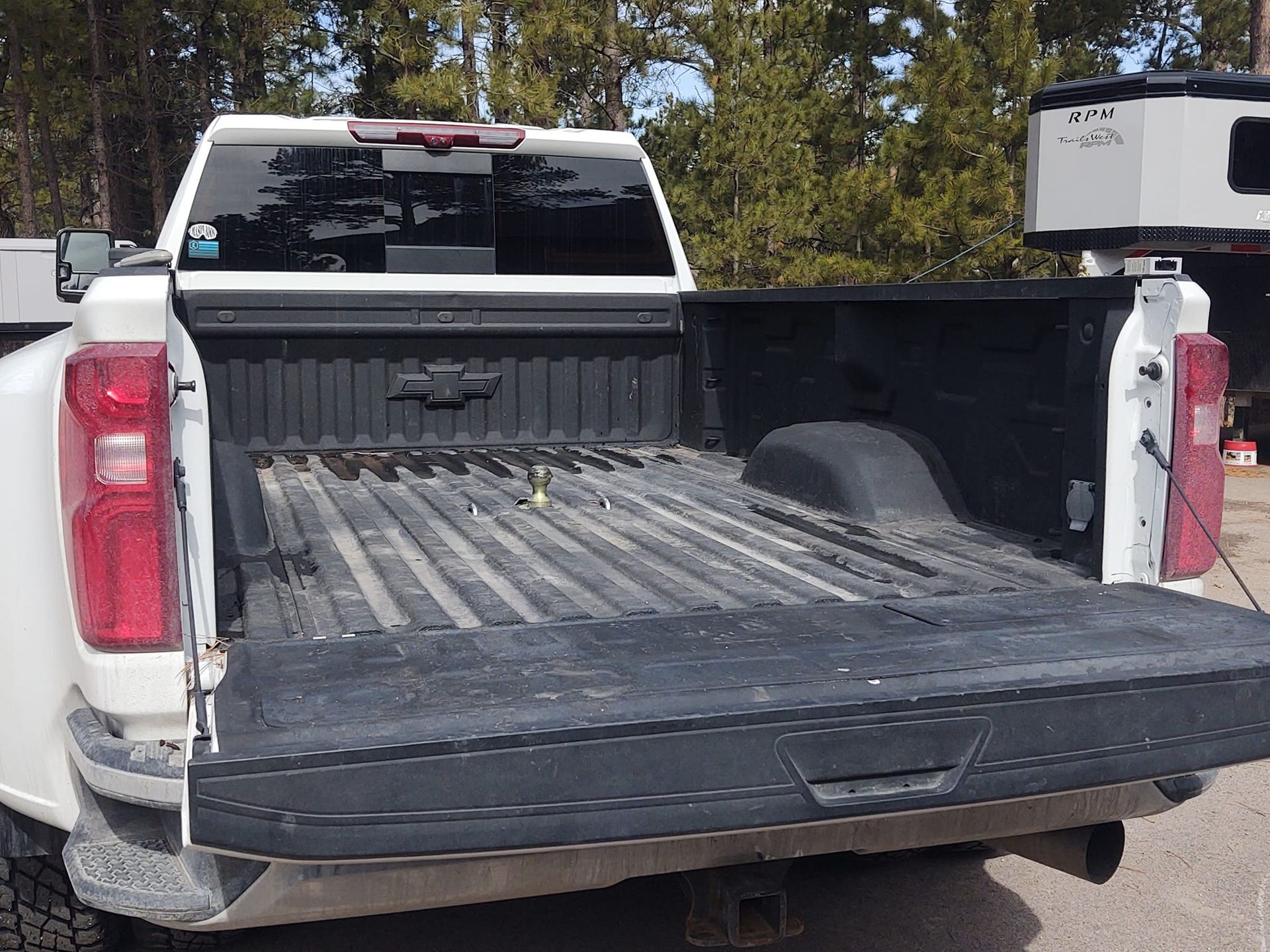 White pickup truck bed with open tailgate