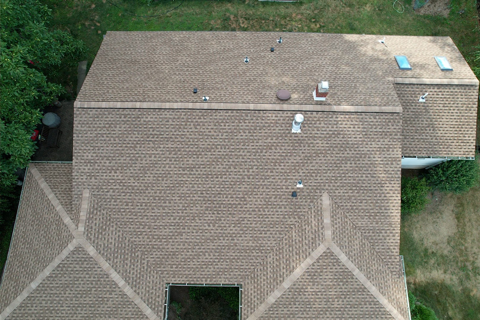 An aerial view of a brick roof of a house