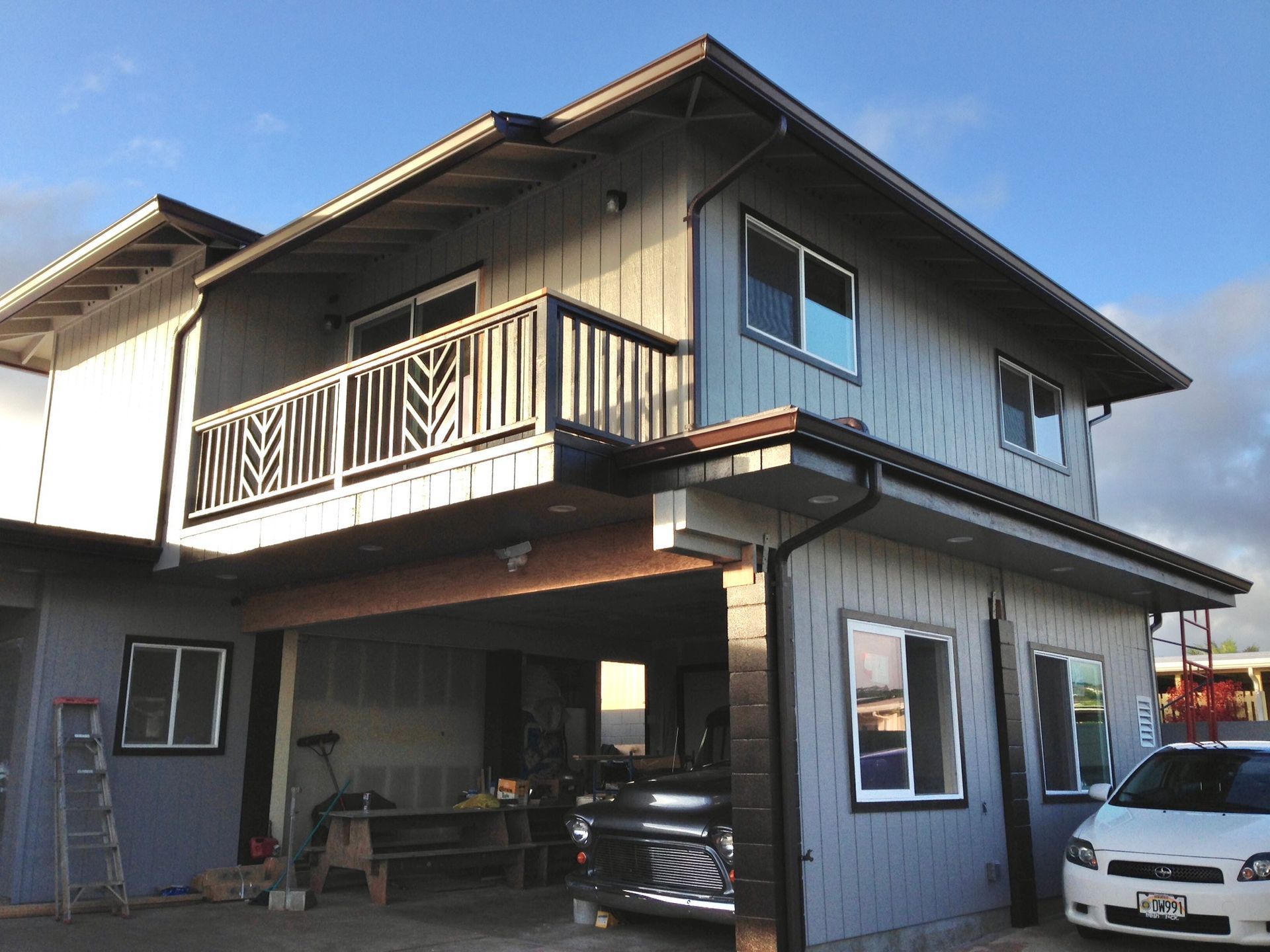 House with a garage and a car parked in front of it