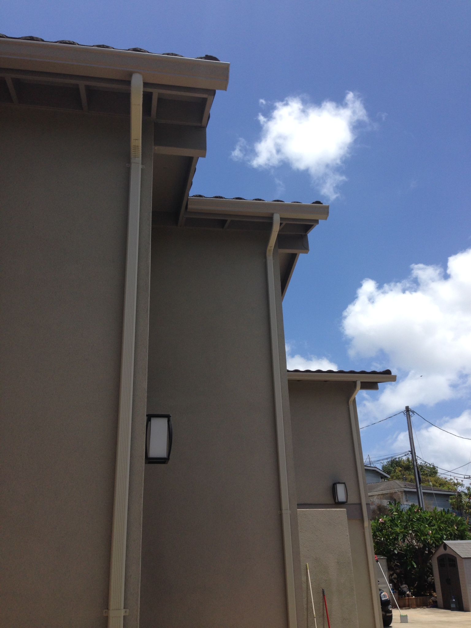 Building with a roof and a blue sky