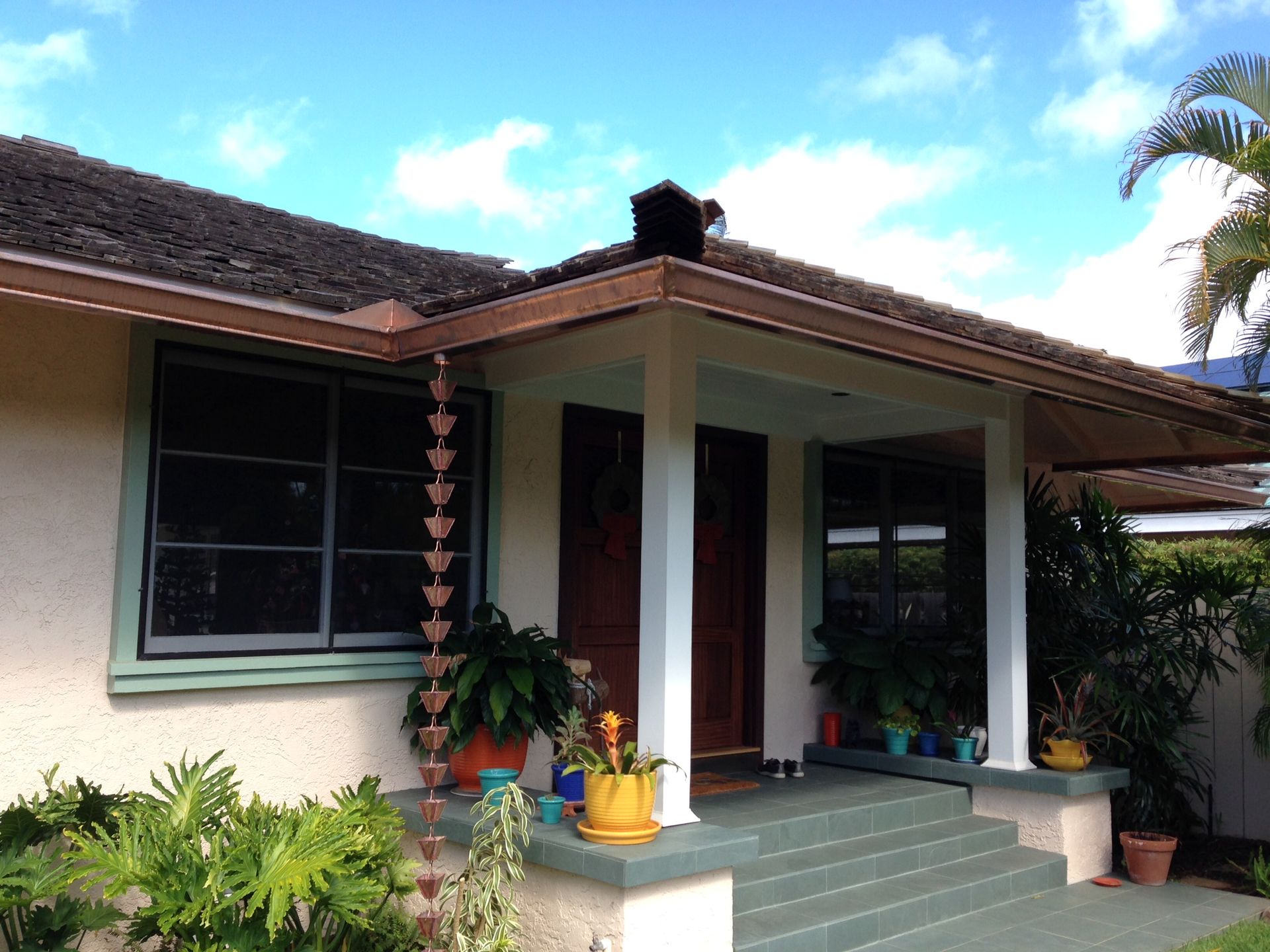 House with a porch and a porch with plants
