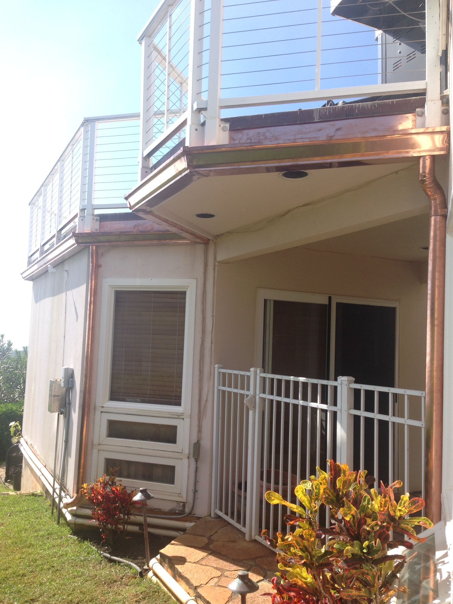 House with a balcony and a metal fence
