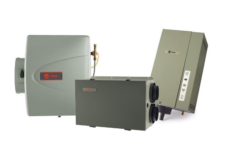 Three different types of air conditioners are sitting next to each other on a white background.