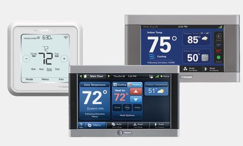 Three thermostats are sitting next to each other on a white background.