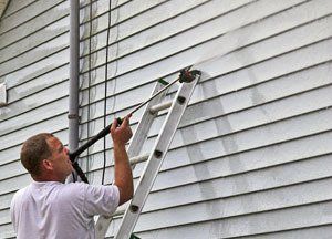 pressure washing the side of a house