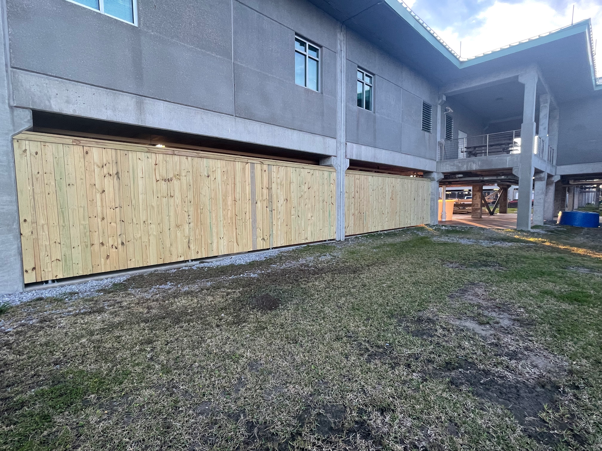 Building with a fence and grass