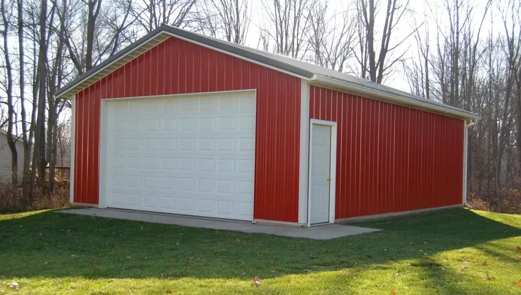 A red and white garage with a white door