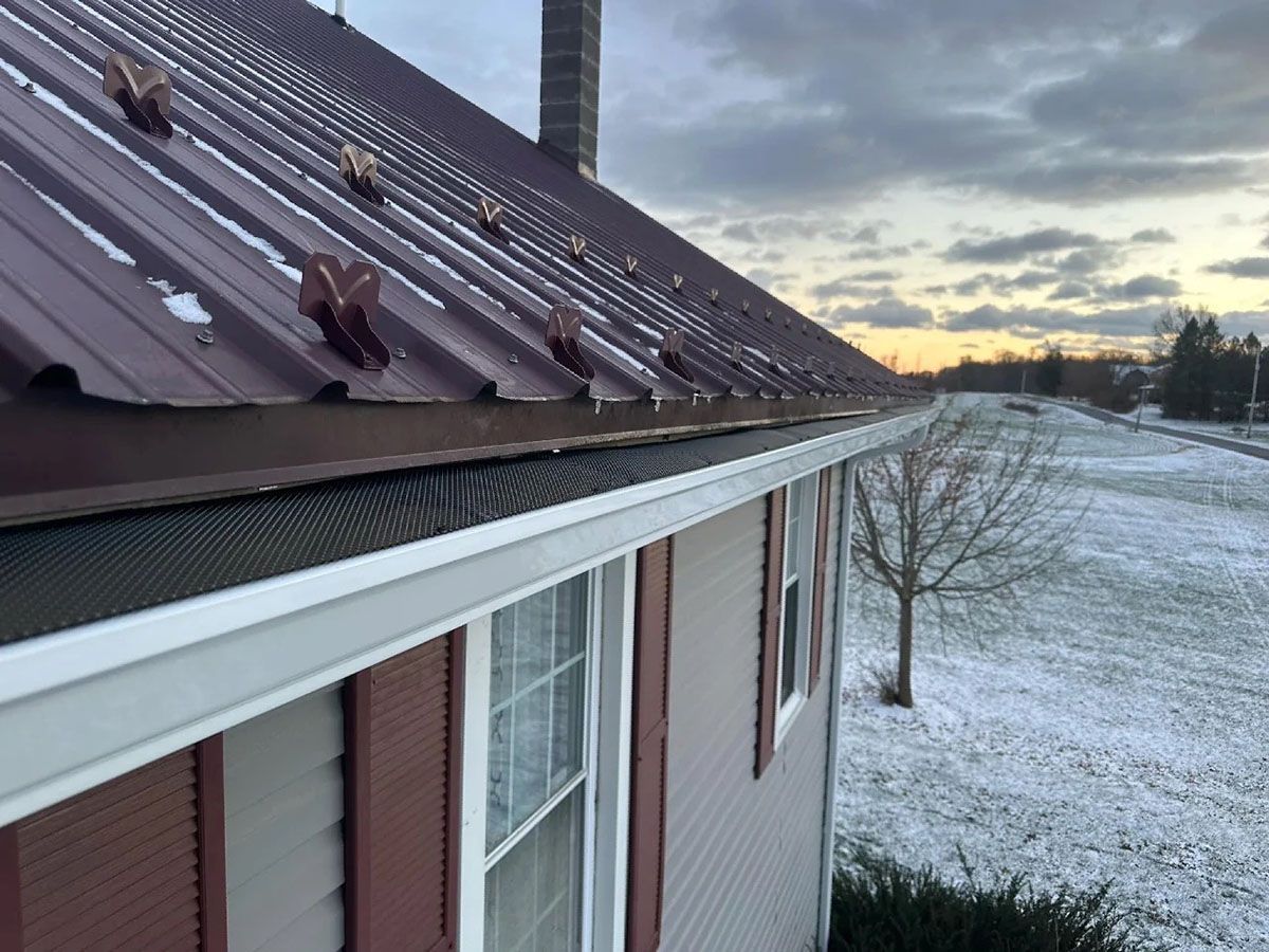 A roof of a house with gutter cover system