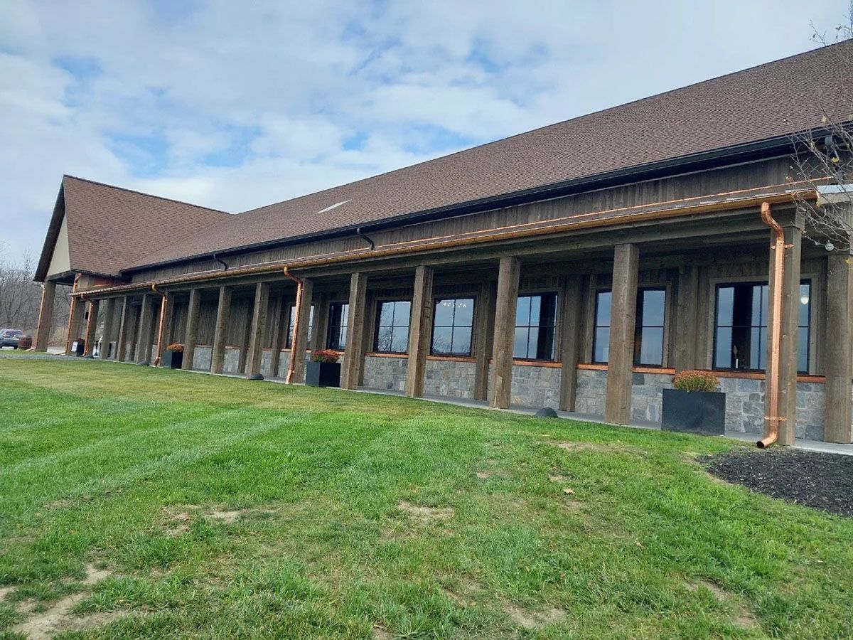 A large building with a newly installed gutter system