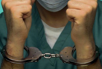 Handcuffed medical staff