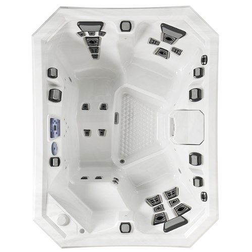 White octagonal hot tub interior with built-in jets and seats, viewed from above