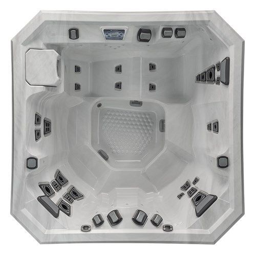 White hot tub interior with multiple jets and seats, viewed from above