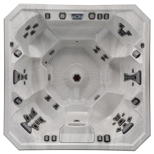 White octagonal hot tub interior with multiple black jets and a central drain.