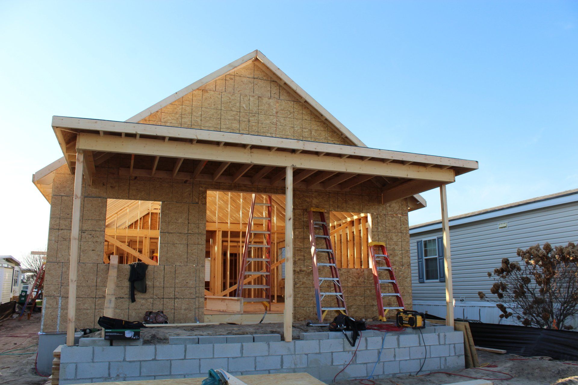 A house that is being built with a porch