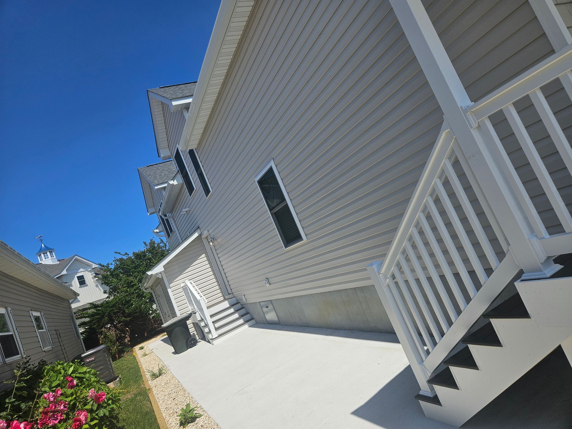 The back of a house with stairs leading up to it