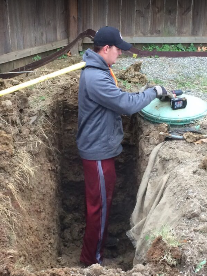 Man installing septic