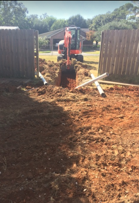 Excavator clearing the land