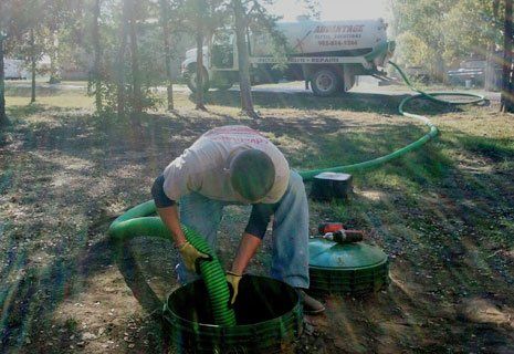 Worker pumping the septic