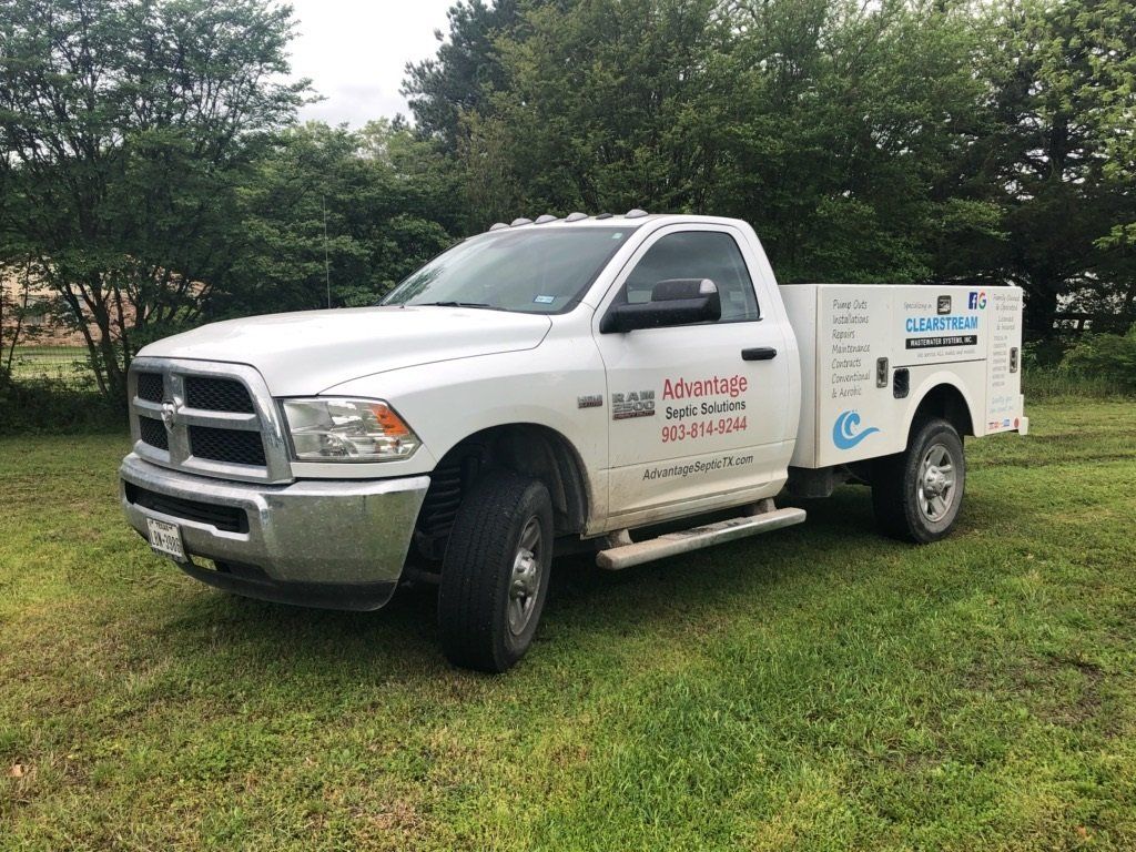 Advantage Septic Solutions white pick up truck